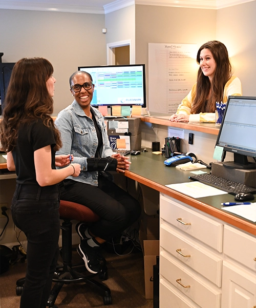 Chiropractic Greenville Team Members Checking In Patient HP