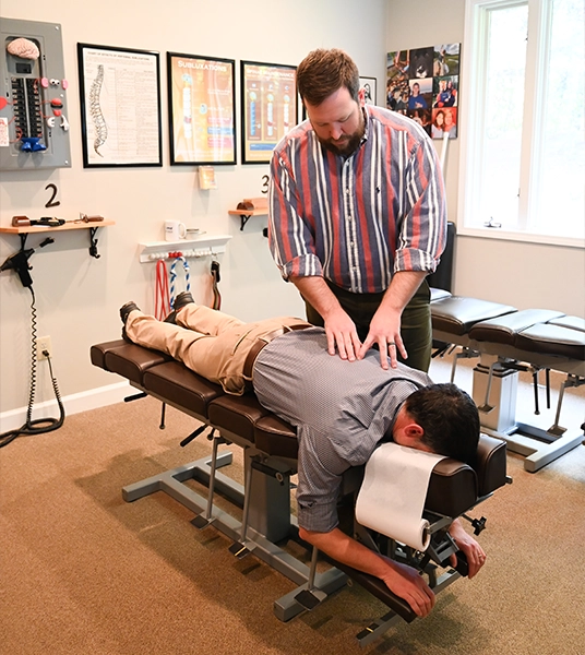 Chiropractor Greenville SC Alex Combs Adjusting Patient HP